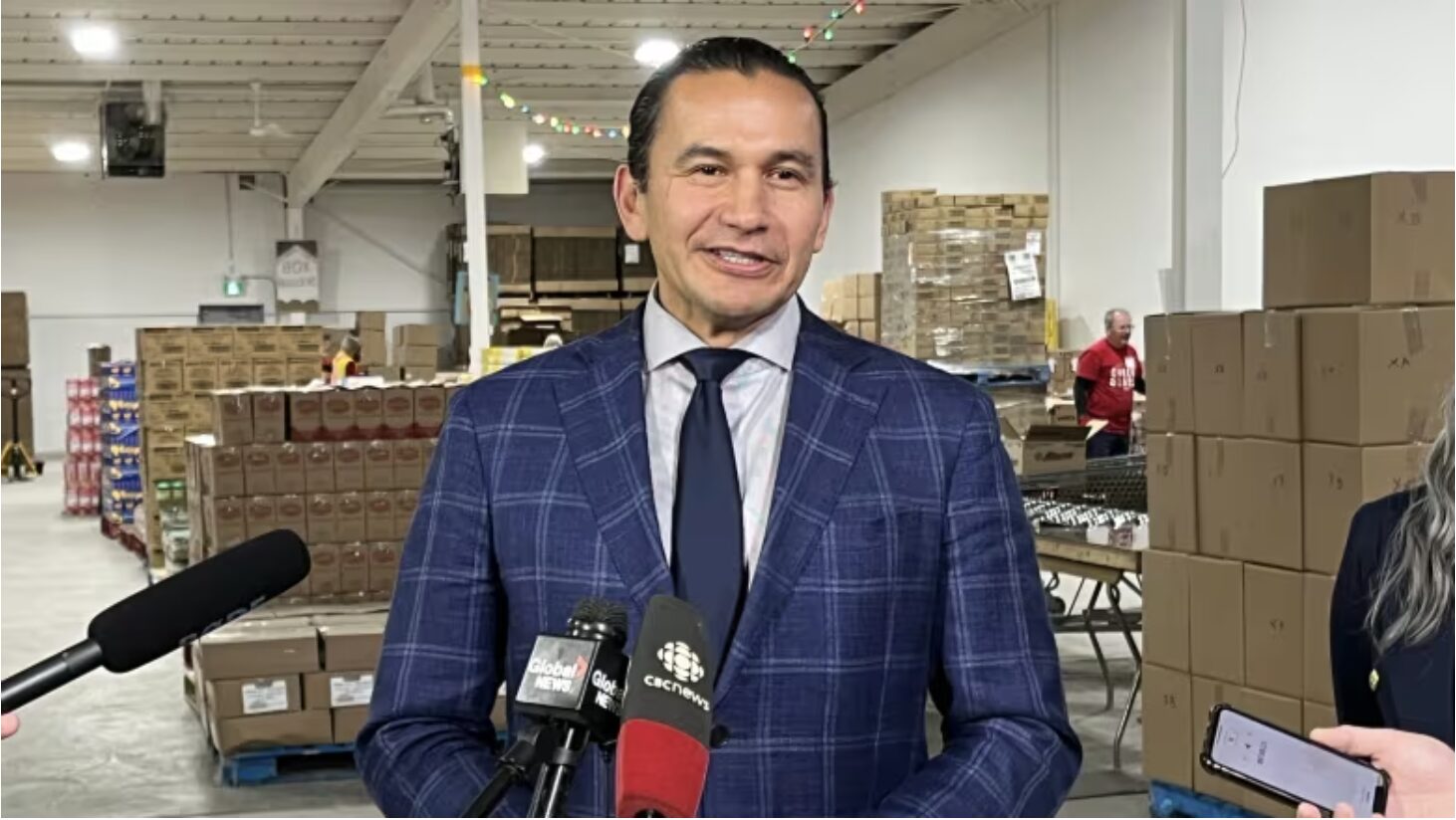 Manitoba Premier Wab Kinew speaks to reporters.